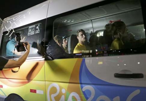 Olympic athletes from Australia leave a police station after being questioned by Brazilian police. Photo: Reuters