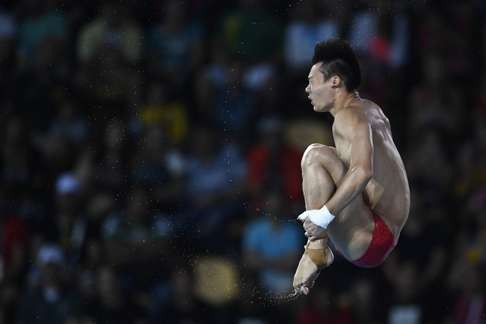 Chen topped 100 points three points on his dives. Photo: AFP