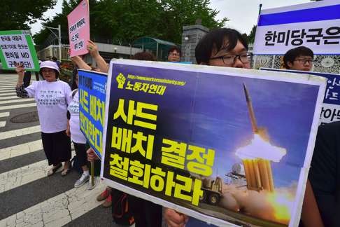 South Korean activists protest outside the defence ministry in Seoul against the deployment of Thaad. Photo: AFP