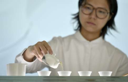 Xie Yu-tung, founder of Xie Xie, demonstrates her tea skills in Taipei. Photo: AFP.