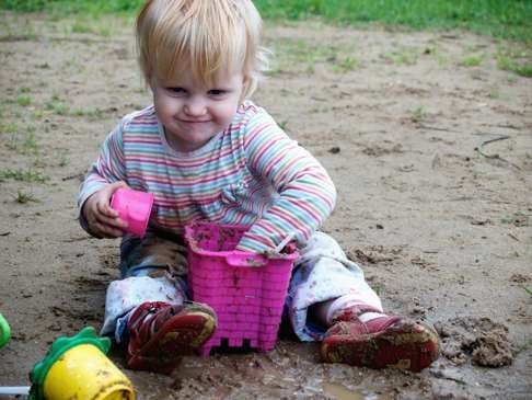 Exposure to microbes in the right form, such as playing in the dirt, may protect a child from developing allergies.