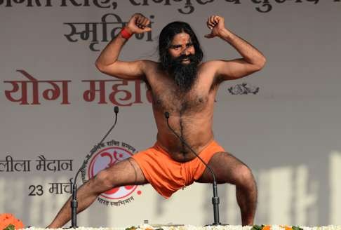 Ramdev performs yoga in New Delhi in 2014. Photo: AFP
