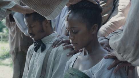 Parker and Aja Naomi King as Cherry in a still from The Birth of a Nation.
