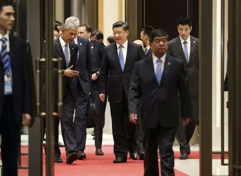 Barack Obama and Xi Jinping head out for their one-to-one session. Photo: AP