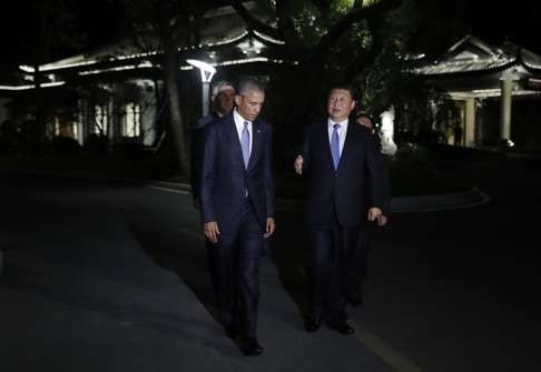 The two presidents chat during their stroll. Photo: AP