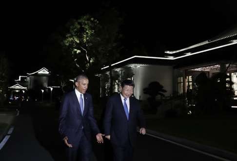 United States President Barack Obama, and Chinese President Xi Jinping, walk together at West Lake State Guest House in Hangzhou on September 3, 2016. Photo: AP