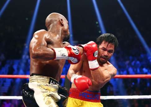 Floyd Mayweather Jnr scored a unanimous win over Pacquiao in their first meeting. Photo: USA Today