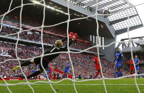 Liverpool’s Adam Lallana scores Liverpool’s third goal. Photo: Reuters