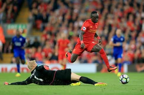 Liverpool’s Sadio Mane takes the ball past Leicester City goalkeeper Kasper Schmeichel. Photo: AP