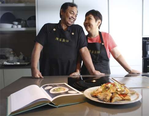 Chan and Fong with their cookbook.