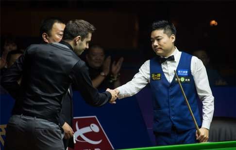 Beaten finalist Mark Selby congratulates Ding on the win after their final.