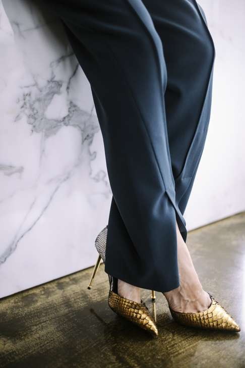 Gold and silver shoes by Tom Ford, dark teal trousers by Johanna Ho. Photo: Bryant Lee