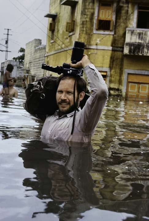 Steve McCurry in monsoon floods, Porbandar, India, 1983.