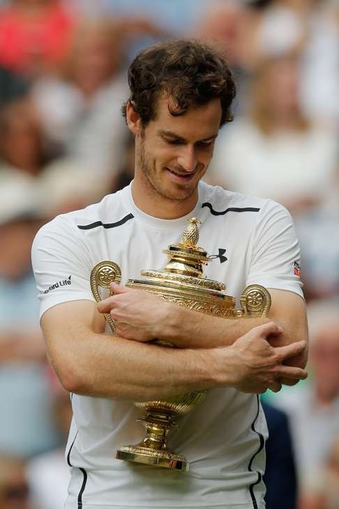 Andy Murray with the Wimbledon trophy. Photo: AFP