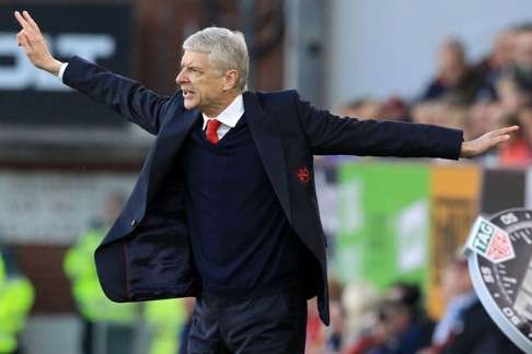 Arsenal’s French manager Arsene Wenger celebrated 20 years in the job with a last-gasp win over Burnley. Photo: AFP