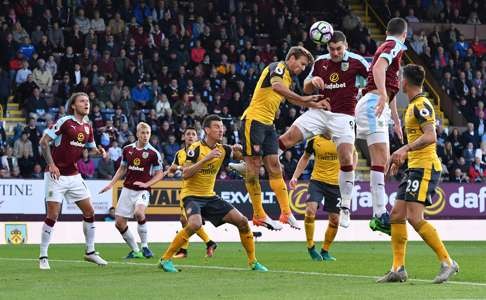 Burnley’s Sam Vokes heads at goal. Photo: Reuters