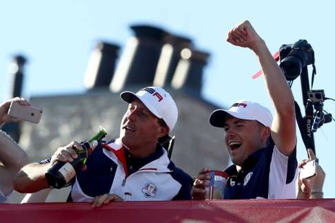 Phil Mickelson and Jordan Spieth of the United States celebrate with champagne after winning the Ryder Cup. Photo: AFP