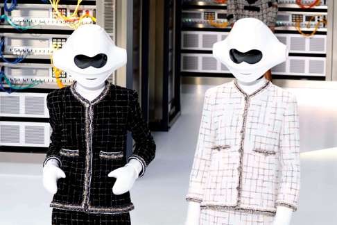 Two models started off Chanel’s digital themed show. Photo: AFP