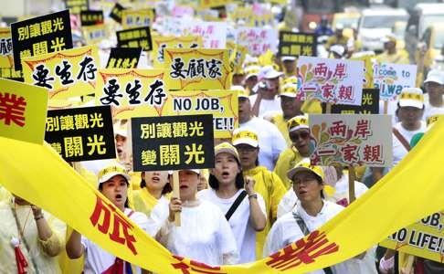 Tourism industry workers demonstrate in Taipei last month, calling on the government to address the decline of mainland visitors since President Tsai Ing-wen took office in May. Photo: AP