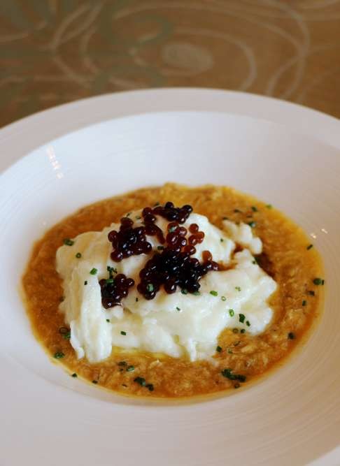 JW Marriott Man Ho's sauteed egg white with hairy crab roe and crab meat.