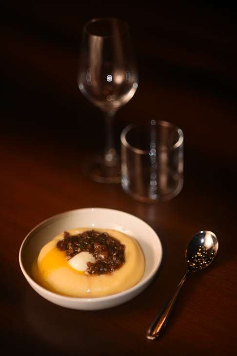 Agria potato puree with pig’s trotter, slow-cooked egg and truffle.
