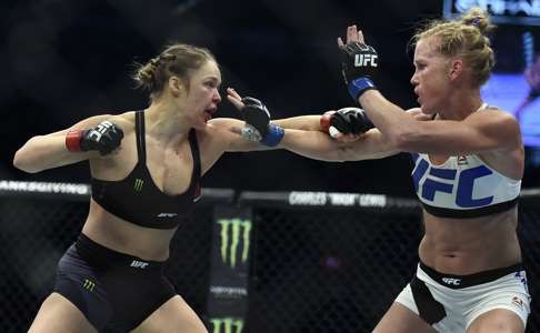 Ronda Rousey (left) and Holly Holm at UFC 193. Photo: AP