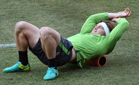 Wallabies player Michael Hooper stretches during a training session in Sydney. Photo: AFP