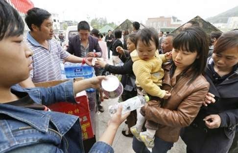 Survivors of the 2013 earthquake in Yaan, Sichuan province. Overseas NGOs with a presence in China, such as World Vision, distributed basic supplies to homeless families. Photo: Kyodo