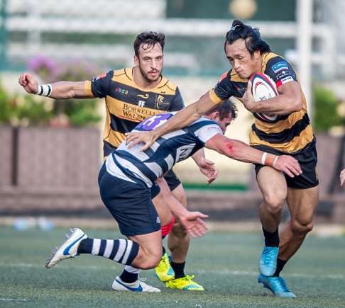Tigers star Salom Yiu Kam-shing takes on his HKFC opponent during his side’s loss.