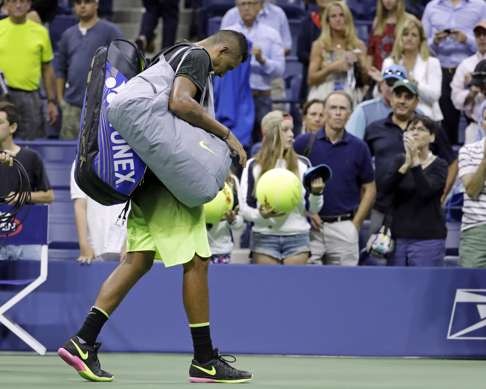 Kyrgios leaves the court after retiring from a match against Illya Marchenko at the US Open. Photo: AP
