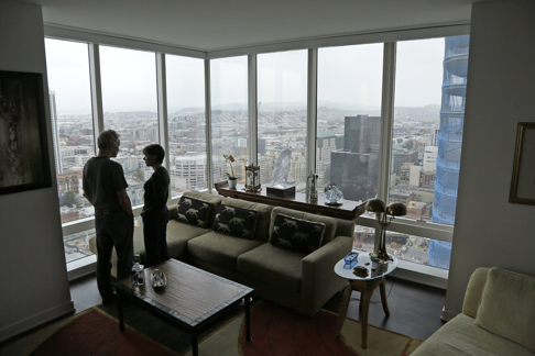 Jerry Dodson and his wife Pat stand inside their home on the 42nd floor of the Millennium Tower in San Francisco. Photo: Eric Risberg/AP