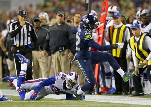 Running back C.J. Prosise of the Seahawks rushes. Photo: AFP