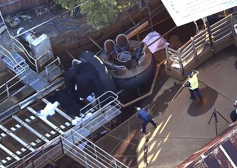 Queensland Emergency Services personnel at the Thunder River Rapids ride. Photo: AP