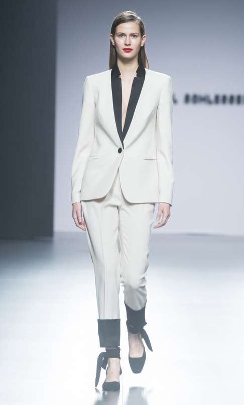 Angel Schlesser’s white pantsuit with black trim.