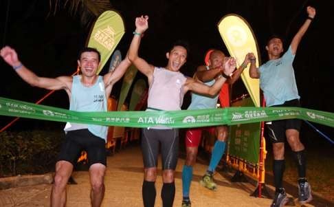 Team 2XU UFO (from left) Tang Sun-kam, Lam Shing-yip, Tsang Chun-kit and Law Chor-kin at the finish line in 2015.