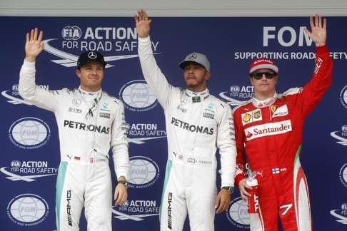 Hamilton (centre), Rosberg (left) and Raikkonen (right) on the podium after qualifying. Photo: EPA