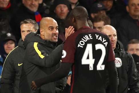 Manchester City's Yaya Toure and manager Pep Guardiola. Photo: Reuters