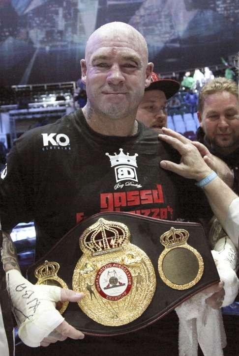 Australia's Lucas Browne celebrates his victory over Uzbekistan's Ruslan Chagaev.