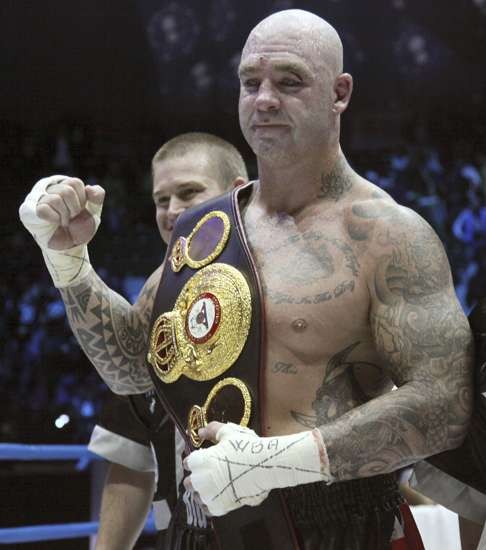 Australia's Lucas Browne celebrates his victory over Uzbekistan's Ruslan Chagaev.