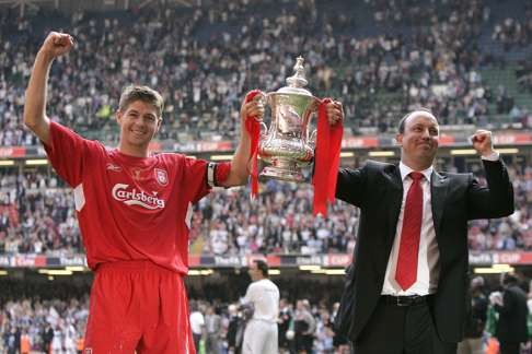 Steven Gerrard and former Liverpool manager Rafael Benitez celebrate winning the 2006 FA Cup. Photo: AP
