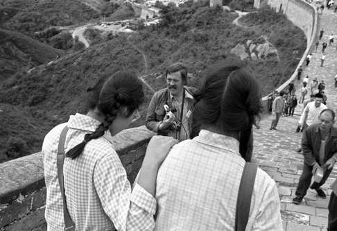 Girls walk down the Great Wall as an AFP photographer makes his way up, in September 1973.