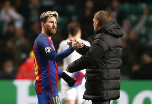 Messi and Celtic manager Brendan Rodgers shake hands after the game. Photo: Reuters
