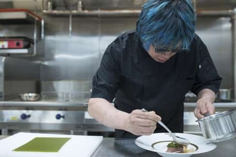 Alvin Leung finishes a dish for the Michelin gala dinner in Macau.