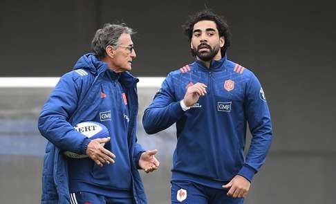 France’s head coach Guy Noves speaks with winger Yoann Huget. Photo: AFP