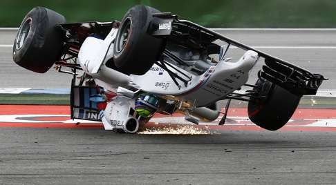 Felipe Massa of Brazil takes a tumble during the 2014 German Grand Prix at Hockenheim. Photo: Reuters