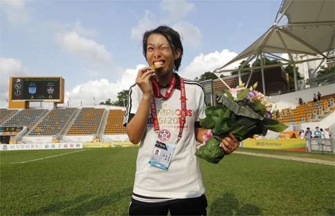 Chan Yuen-ting poses with medal after winning the Hong Kong Premier League title with Eastern last season. Photo: AP