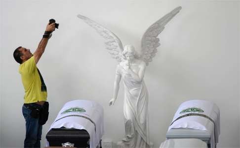 Coffins of the Chapecoense team players are seen at the Mortoury San Vicente in Medellin, Colombia. Photo: AFP