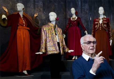 French fashion designer Hubert de Givenchy with some of his designs at the Gemeentemuseum. Photo: AFP