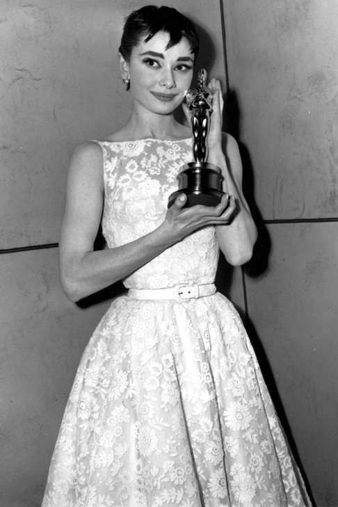 Audrey Hepburn wore a delicate ivory lace Givenchy creation when she accepted her Oscar for best actress in 1954.