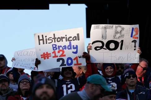 Fans hold signs for Brady during the game between the New England Patriots and the Los Angeles Rams. Photo: AFP